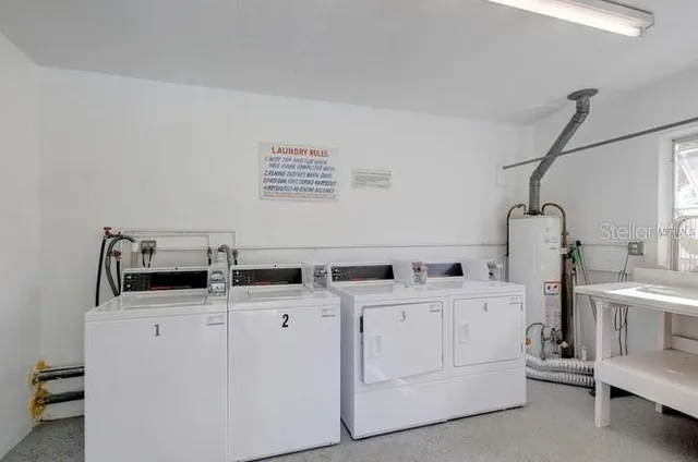 a front view of a house with a yard table and chairs
