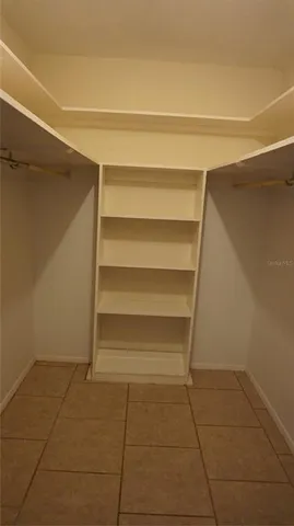 a room with a bench and a door