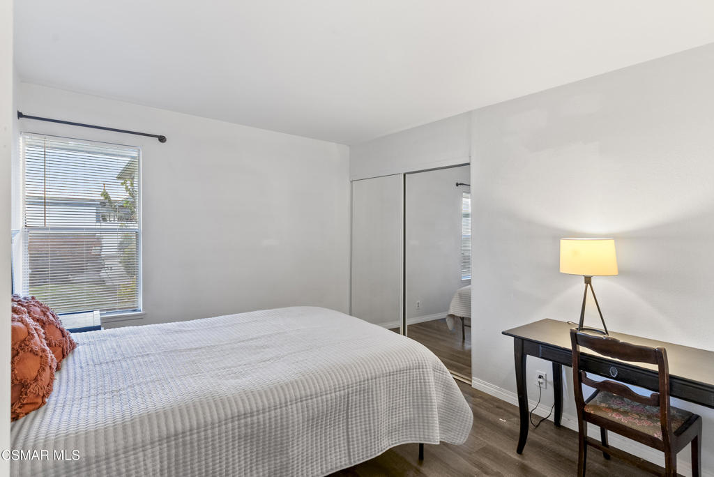 2324 Miramar Walk Oxnard, CA 93035 - Photo 13 of 24 a bedroom with a bed a lamp and a window