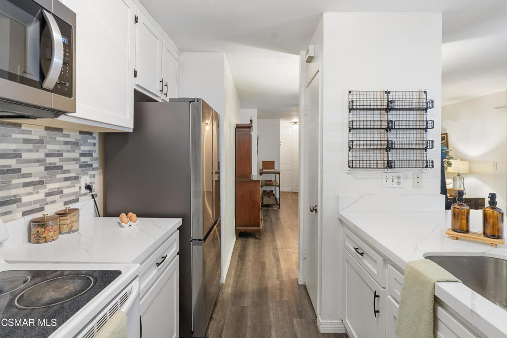 2324 Miramar Walk Oxnard, CA 93035 - Photo 9 of 24 a kitchen with a sink stove and refrigerator