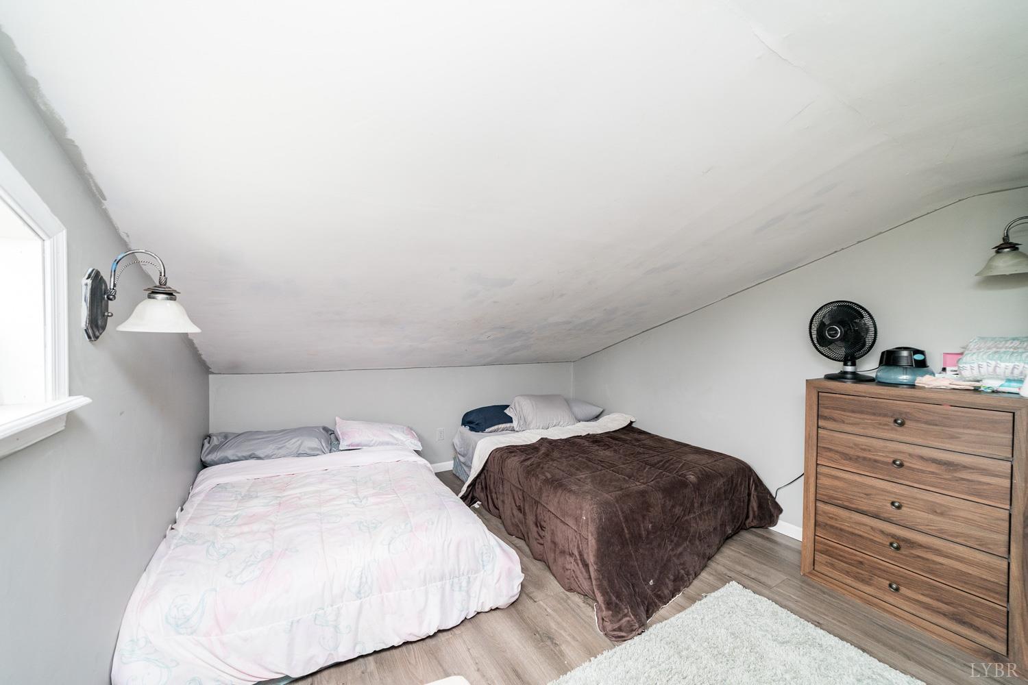 360 Theta Mill Road Gladys, VA 24554 - Photo 20 of 25 a bedroom with two bed and a dresser