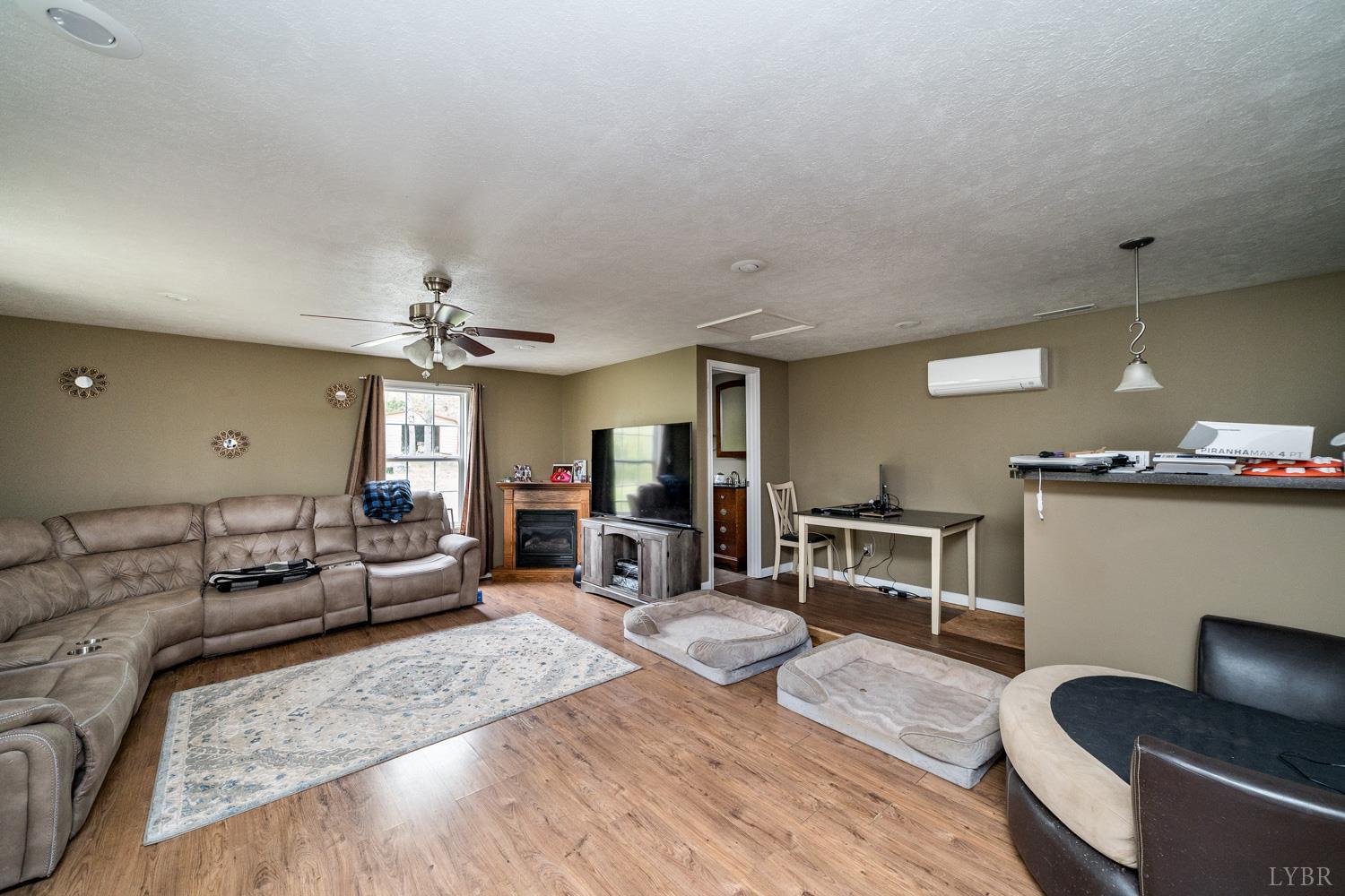 360 Theta Mill Road Gladys, VA 24554 - Photo 9 of 25 a living room with furniture and a wooden floor