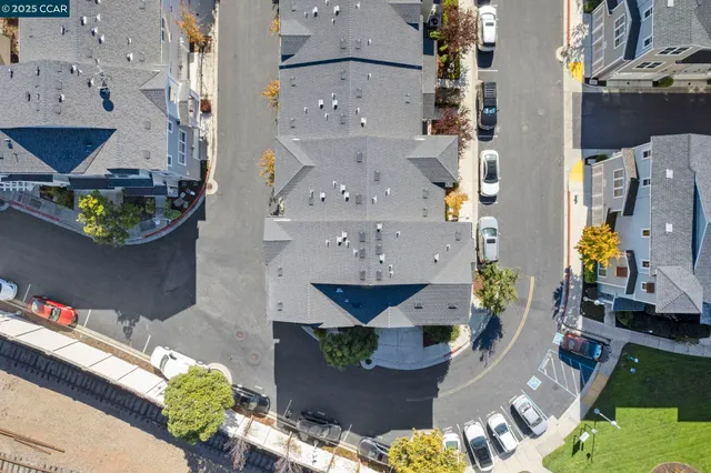 an aerial view of multiple houses with outdoor space