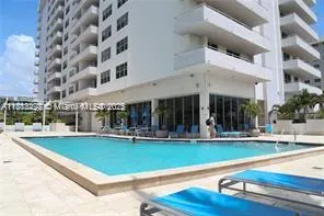 front view of a building with a swimming pool