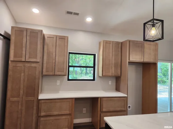 a bathroom with a bathtub sink and mirror
