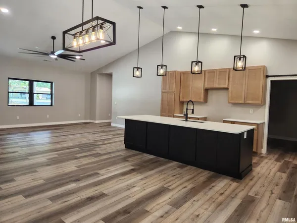 an empty room with wooden floor