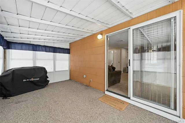 a living room with a black white checkered floor