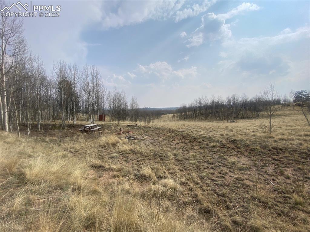 128 Ignacio Way Como, CO 80456 - Photo 7 of 11 a view of a lake with a big yard