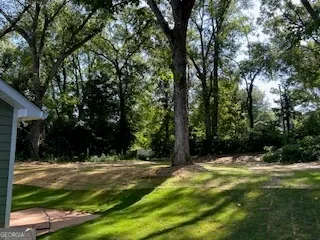 a view of house with yard