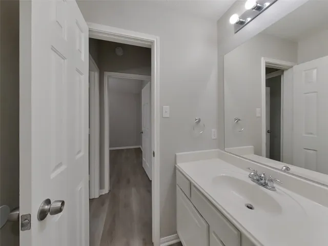 a bathroom with a sink and mirror
