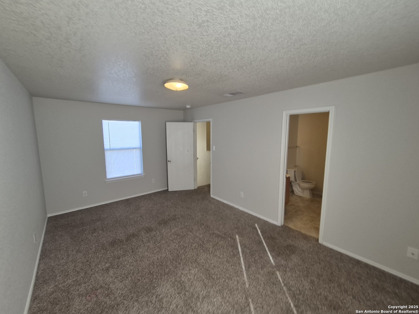102 Kenrock Ridge San Antonio, TX 78254 - Photo 18 of 30 a view of an empty room and window