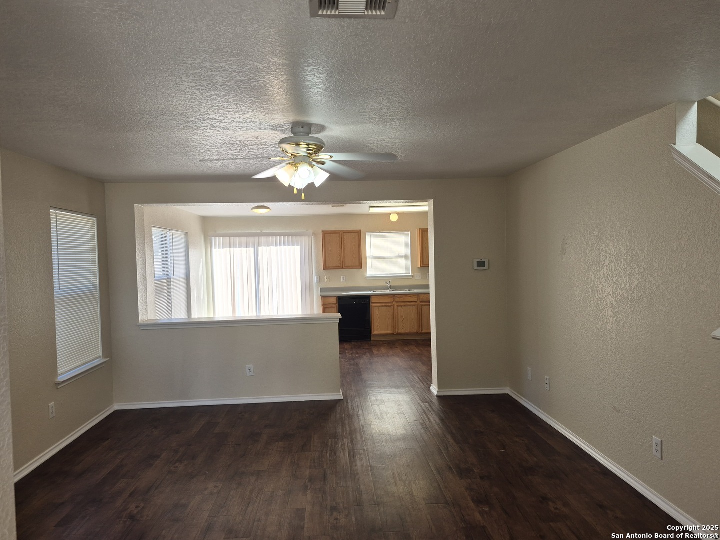 102 Kenrock Ridge San Antonio, TX 78254 - Photo 2 of 30 an empty room with wooden floor and windows