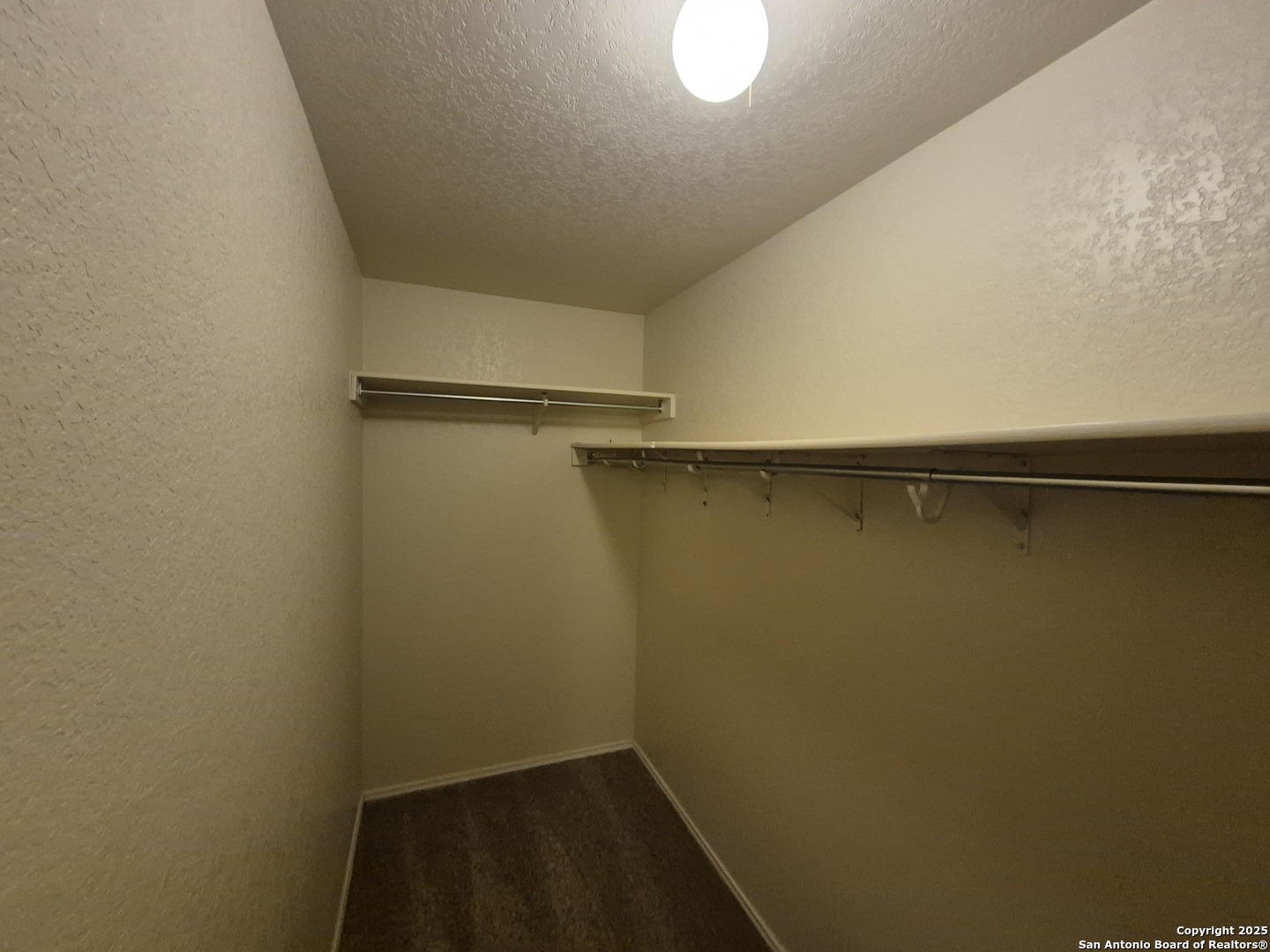 102 Kenrock Ridge San Antonio, TX 78254 - Photo 22 of 30 a view of a room with racks on the wall
