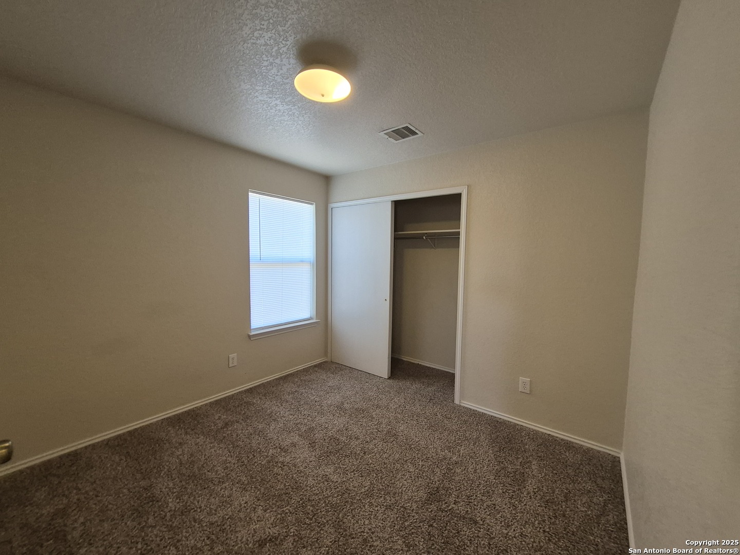 102 Kenrock Ridge San Antonio, TX 78254 - Photo 23 of 30 an empty room with windows and closet