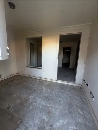 wooden floor and window in an empty room