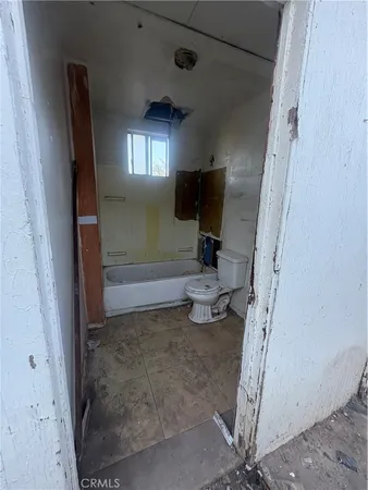 a view of storage and utility room with washer and dryer