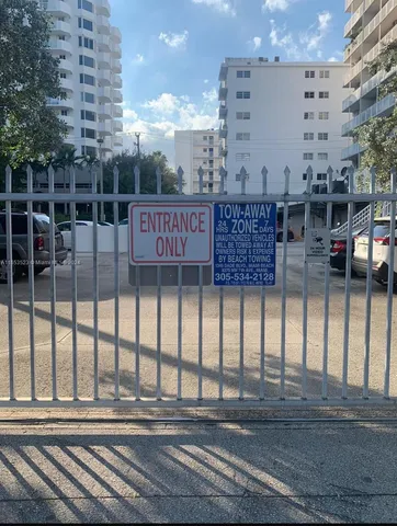 a front view of a building with a yard