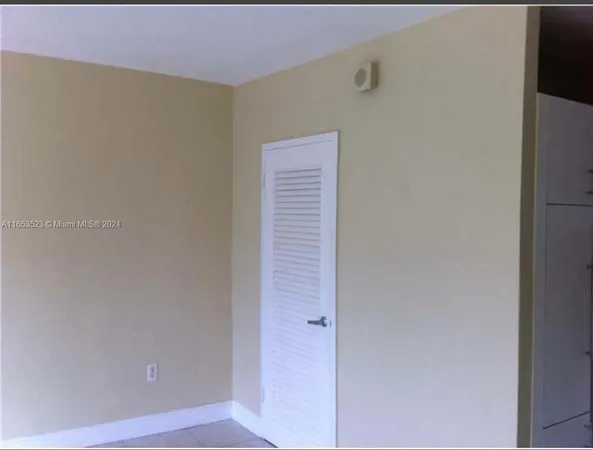 a view of empty room with windows