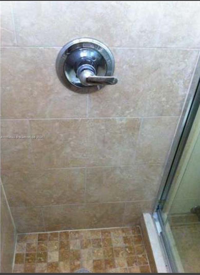 1300 Lincoln Road, Unit F306 Miami Beach, FL 33139 - Photo 10 of 12 a bathroom with a shower