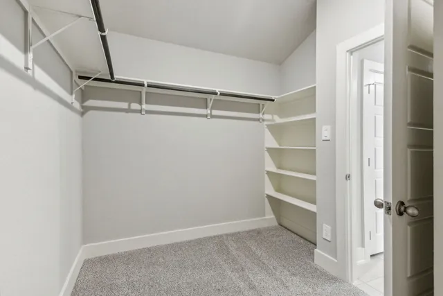 a view of an empty walk in closet