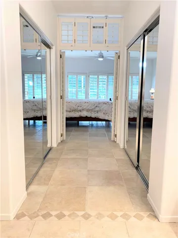 a view of entryway with bathroom and shower