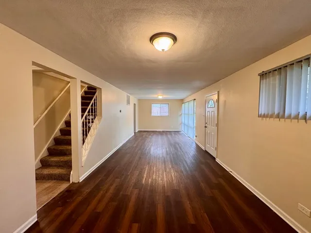 a view of entryway with wooden floor