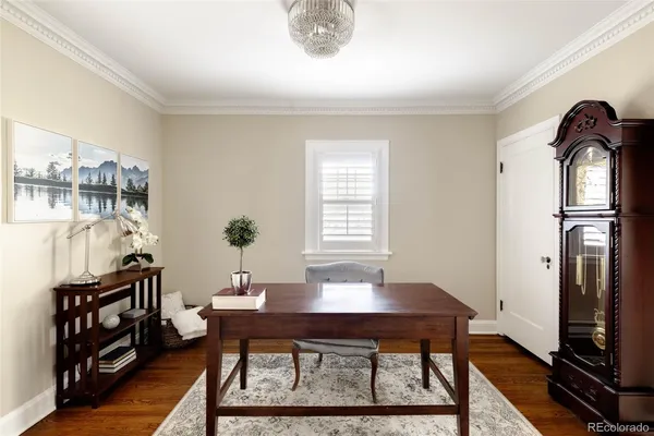 a view of a dining room with furniture and window