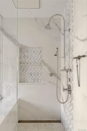 a bathroom with a glass shower door
