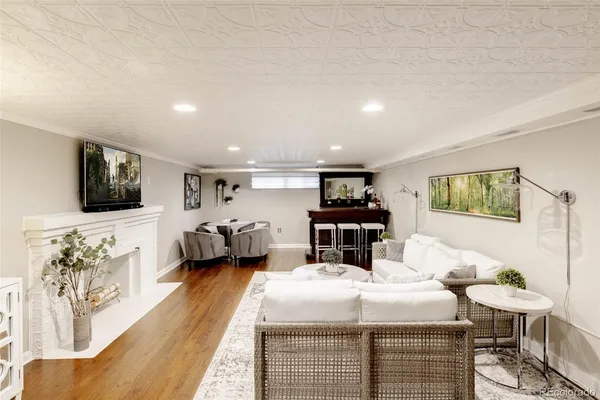 a bedroom with furniture and a flat screen tv