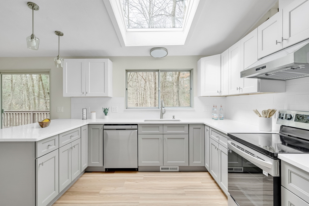 22 Partridge Road Lexington, MA 02420 - Photo 14 of 42 a kitchen with a sink window and cabinets