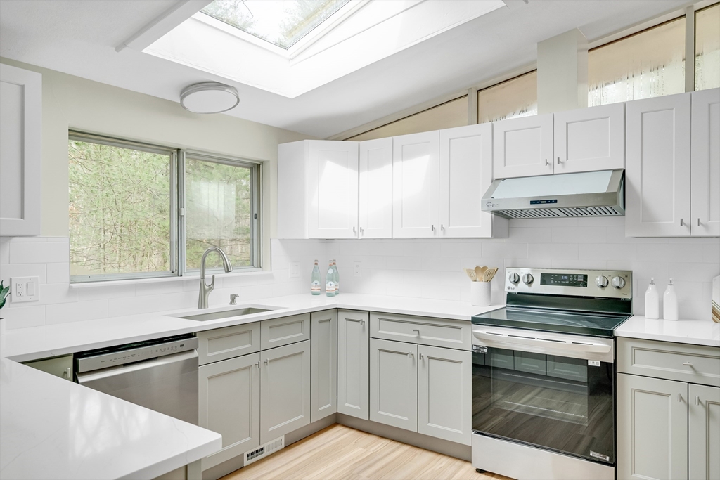 22 Partridge Road Lexington, MA 02420 - Photo 17 of 42 a kitchen with a sink stove top oven and cabinets