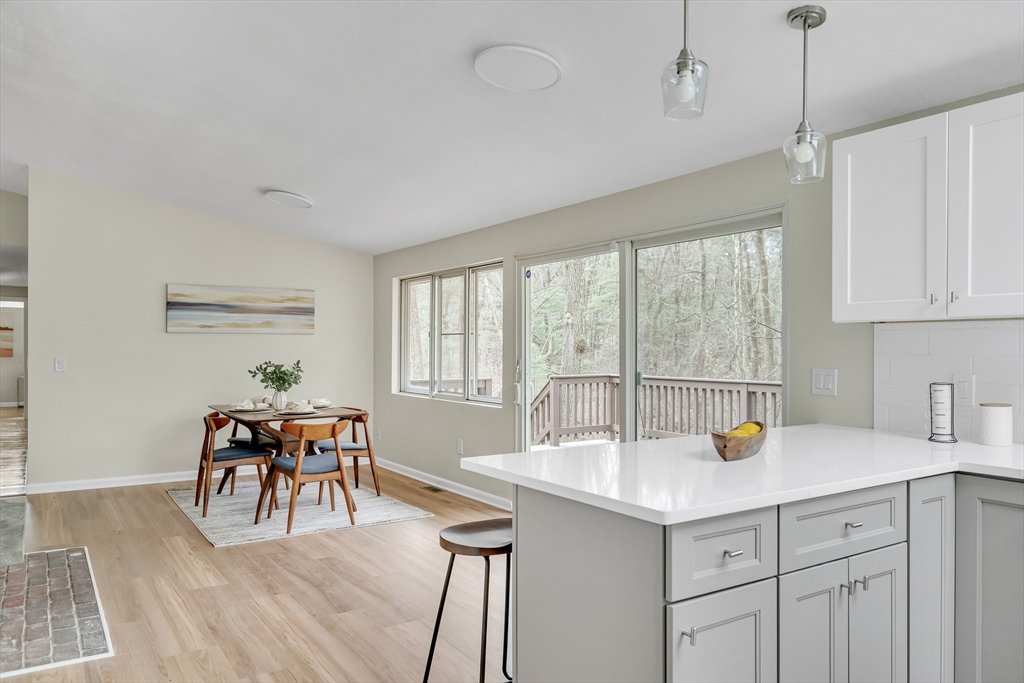 22 Partridge Road Lexington, MA 02420 - Photo 18 of 42 a kitchen with a sink cabinets and dining table chair