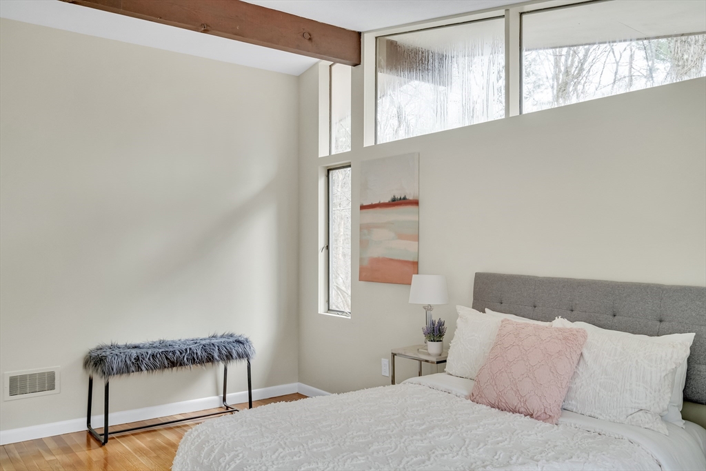22 Partridge Road Lexington, MA 02420 - Photo 28 of 42 a bedroom with a bed and a window
