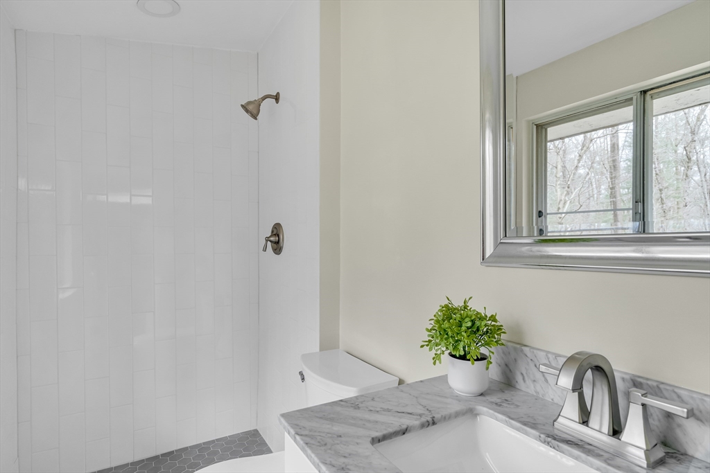 22 Partridge Road Lexington, MA 02420 - Photo 29 of 42 a bathroom with a sink shower and a window