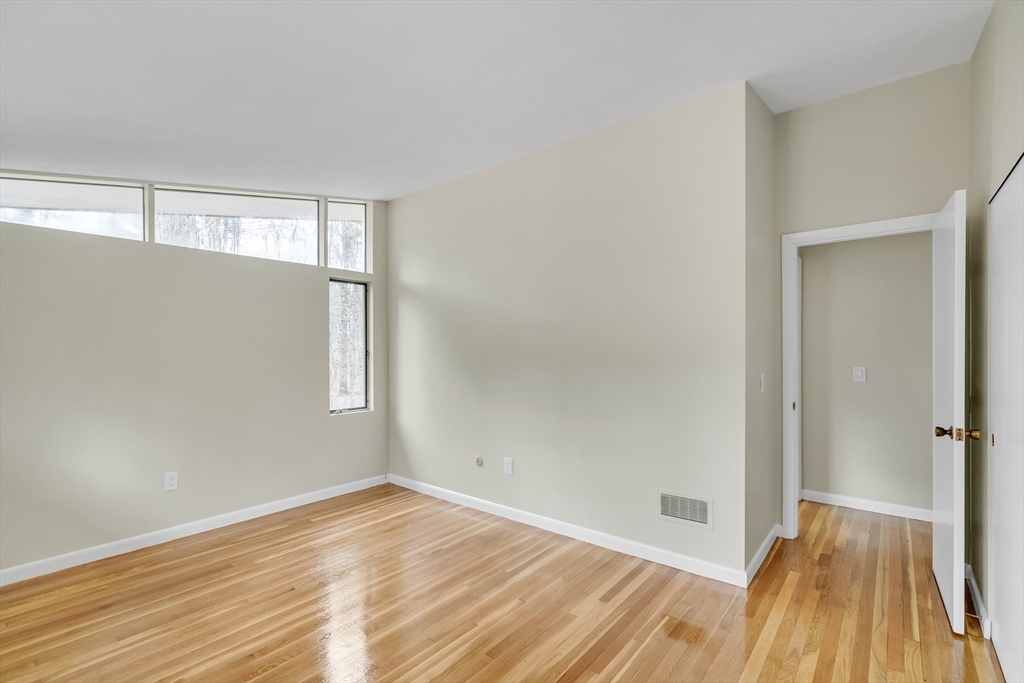 22 Partridge Road Lexington, MA 02420 - Photo 33 of 42 a view of empty room with wooden floor and fan