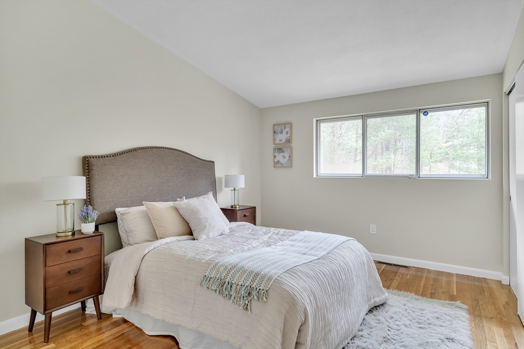22 Partridge Road Lexington, MA 02420 - Photo 34 of 42 a bedroom with a bed and wooden floor