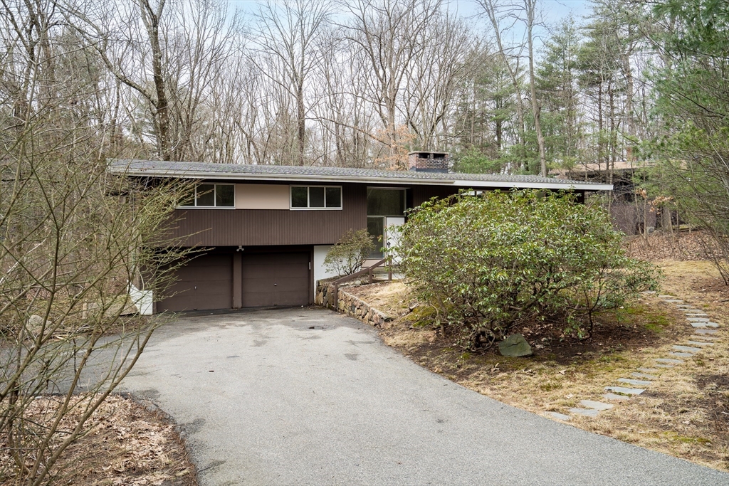 22 Partridge Road Lexington, MA 02420 - Photo 5 of 42 a backyard of a house with lots of green space