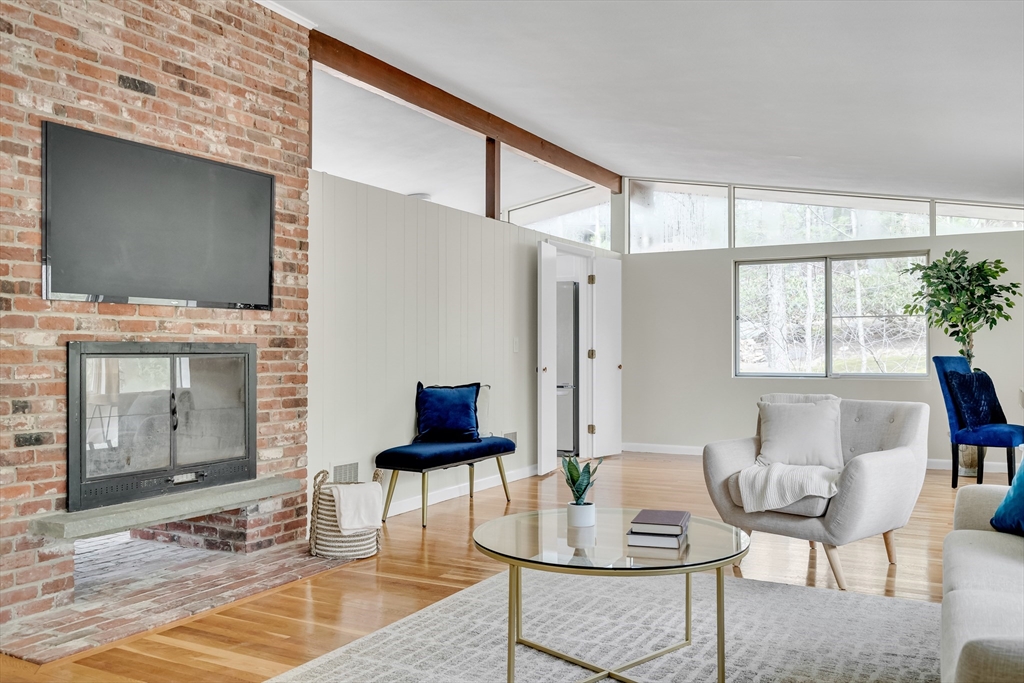 22 Partridge Road Lexington, MA 02420 - Photo 9 of 42 a living room with furniture and a flat screen tv