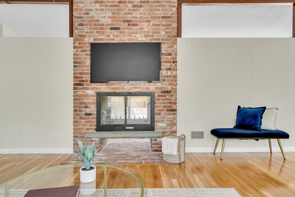 22 Partridge Road Lexington, MA 02420 - Photo 10 of 42 a living room with a fireplace and a rug