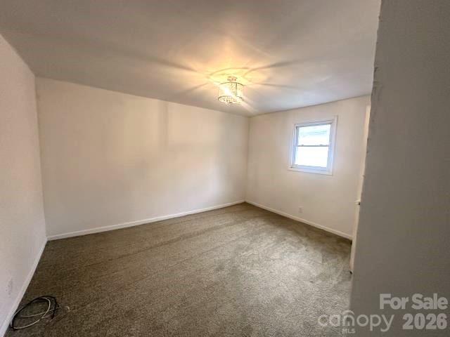 111 Dye Street Chester, SC 29706 - Photo 9 of 12 an empty room with windows and fan