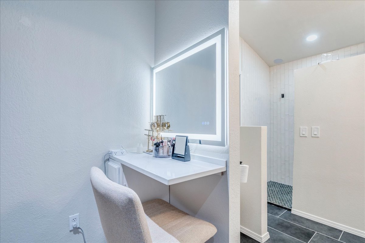 175 Wetzel Kyle, TX 78640 - Photo 17 of 27 A dedicated vanity with a backlit mirror offers a perfect space for grooming and styling.