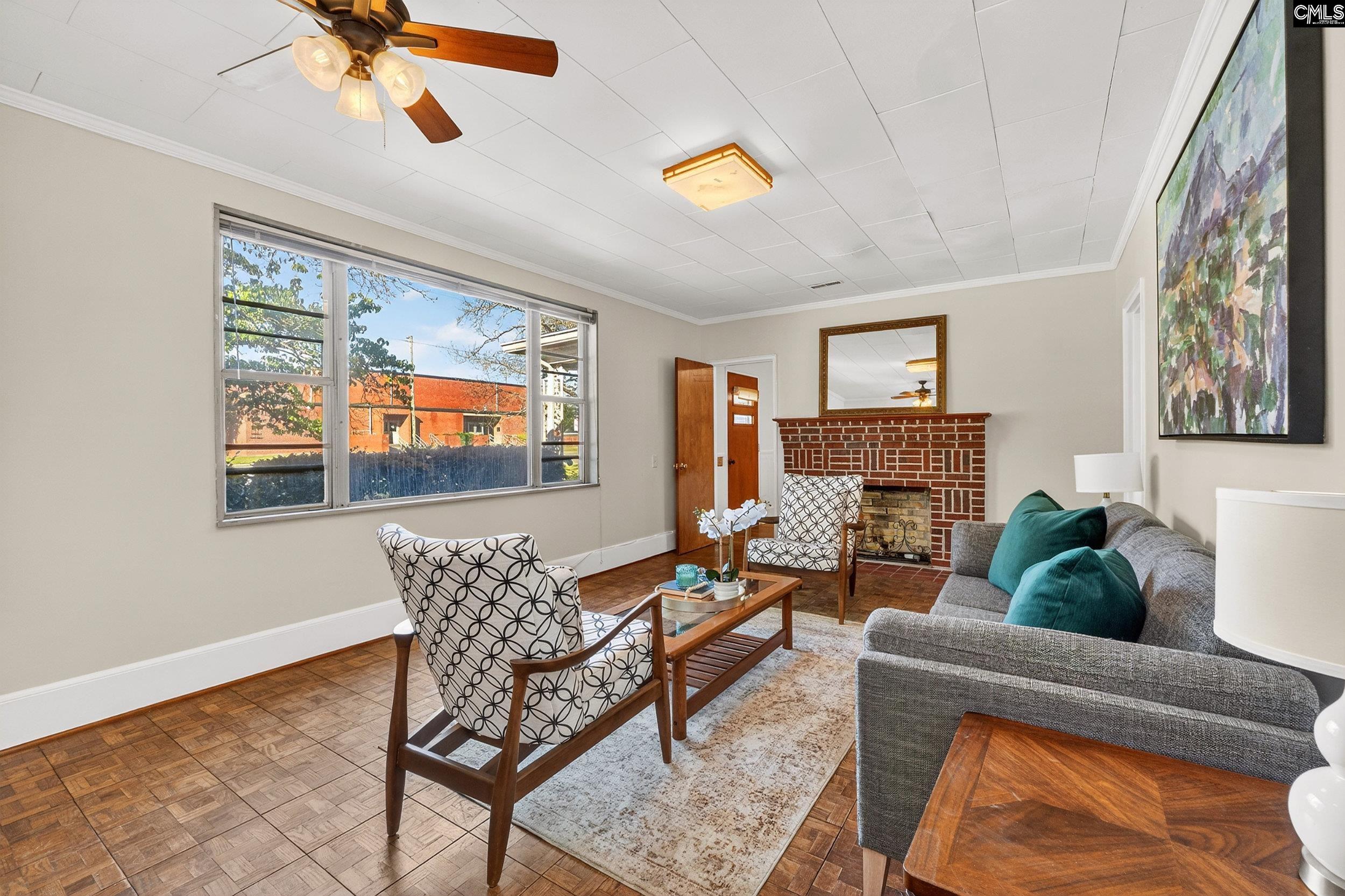 729 Magnolia Street Pelion, SC 29123 - Photo 3 of 32 a living room with furniture and a fireplace