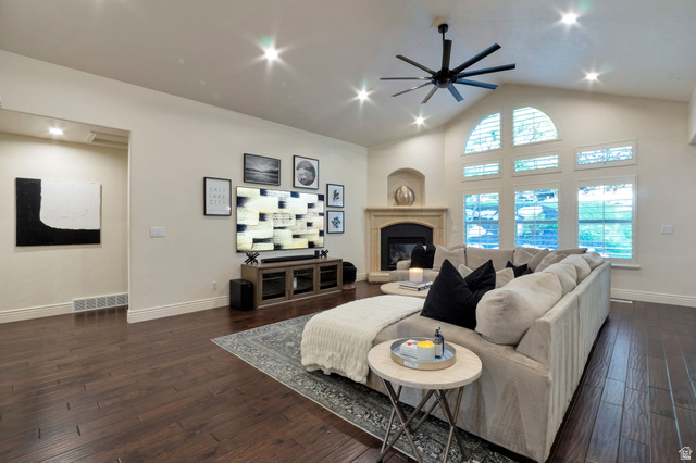 577 South Ridge Top Lane East North Salt Lake, UT 84054 - Photo 3 of 57 Dramatic great room featuring vaulted ceilings, oversized windows, stone fireplace, and abundant natural light.