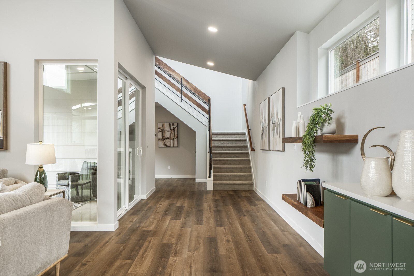 10024 Northeast 196th Place Bothell, WA 98011 - Photo 12 of 40 a kitchen with stainless steel appliances a refrigerator a sink and wooden floor