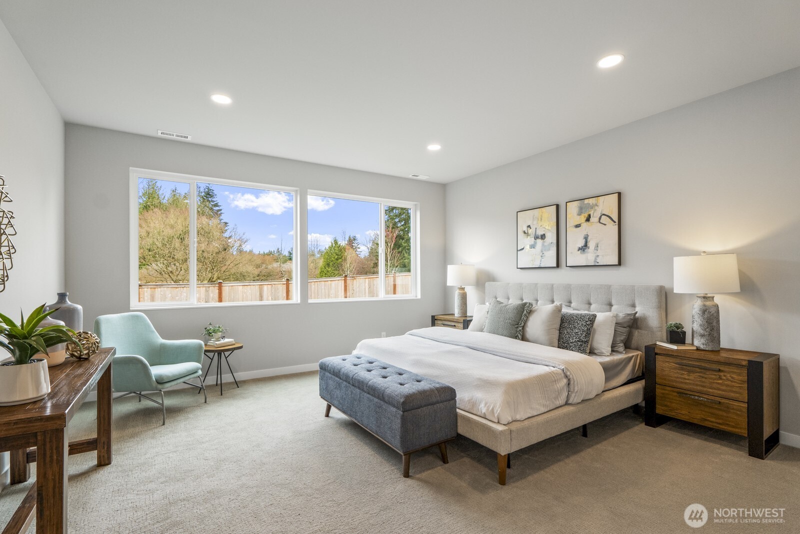 10024 Northeast 196th Place Bothell, WA 98011 - Photo 16 of 40 a spacious bedroom with a bed and a large window