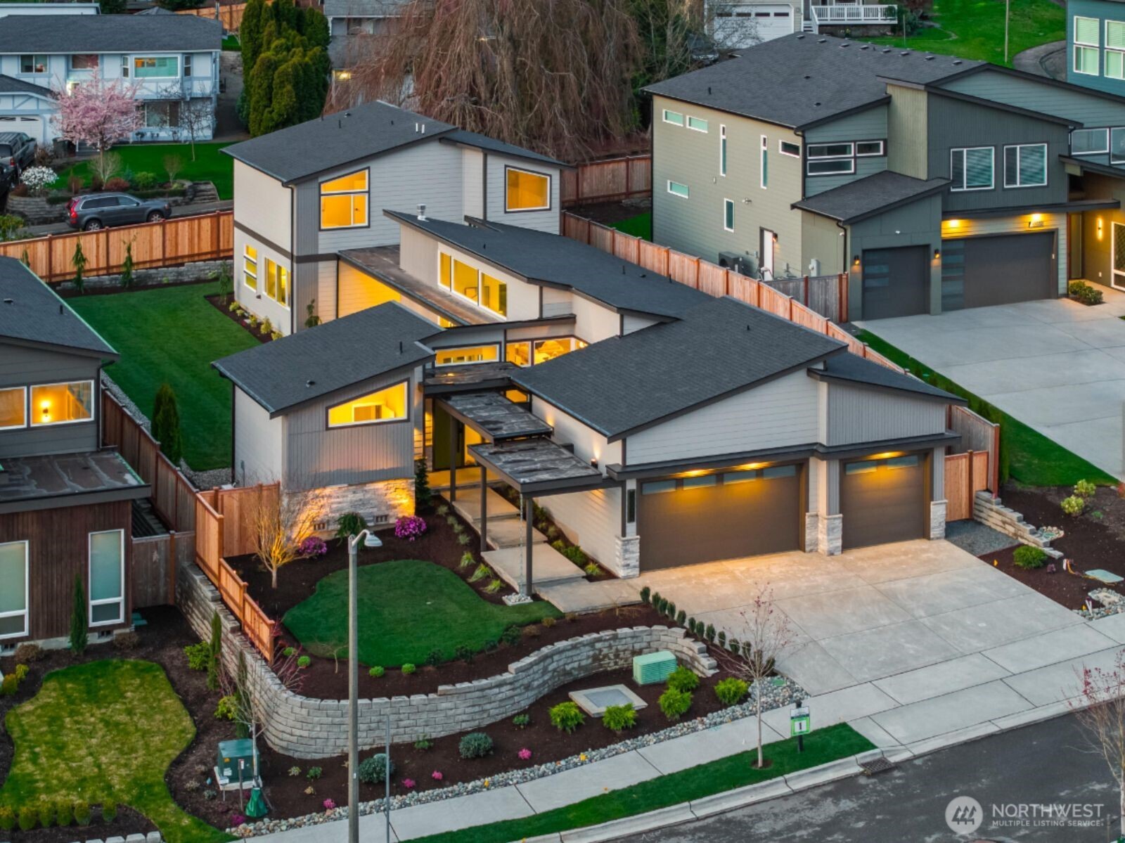 10024 Northeast 196th Place Bothell, WA 98011 - Photo 2 of 40 a front view of a house with a yard and potted plants