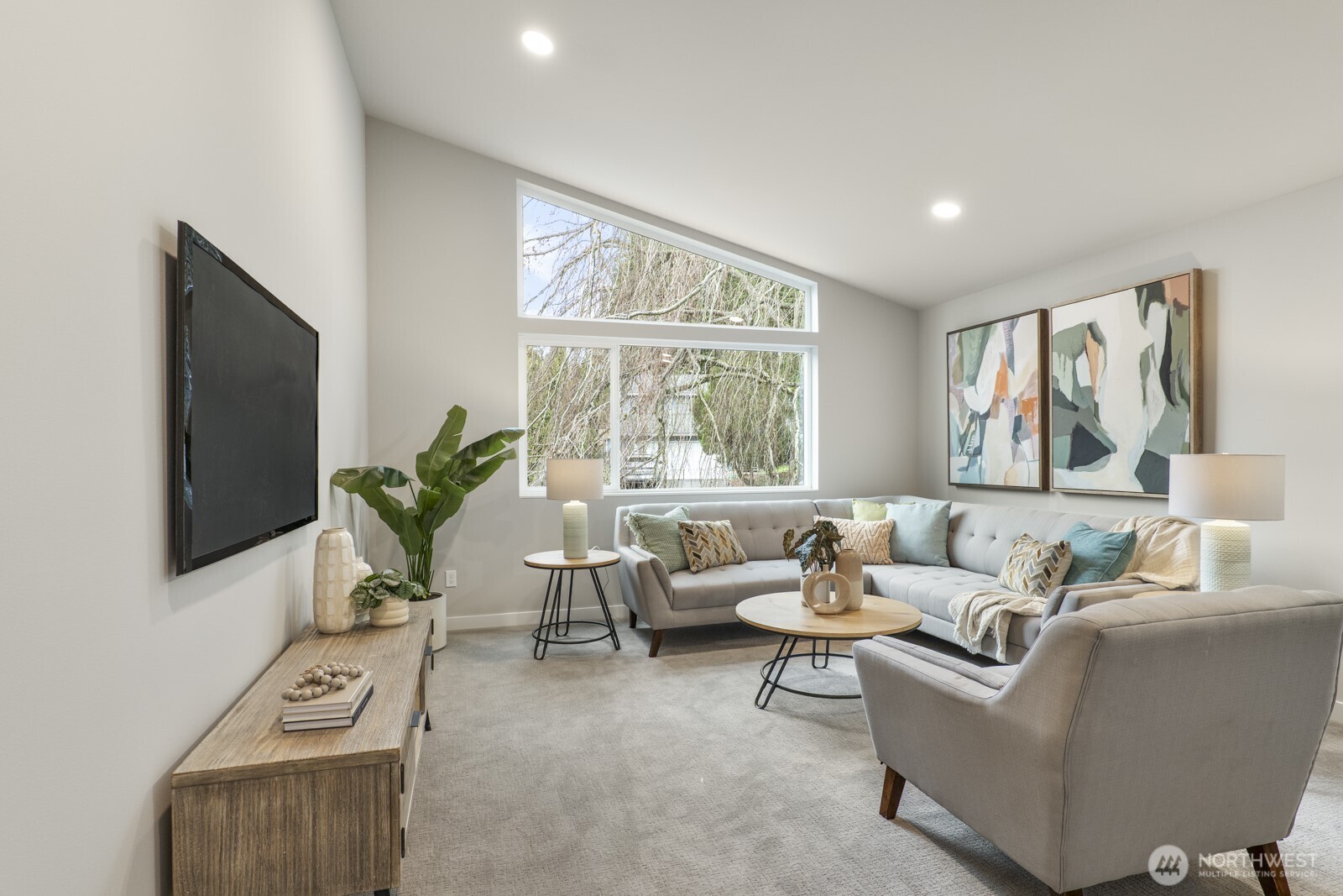 10024 Northeast 196th Place Bothell, WA 98011 - Photo 26 of 40 a living room with furniture and a flat screen tv