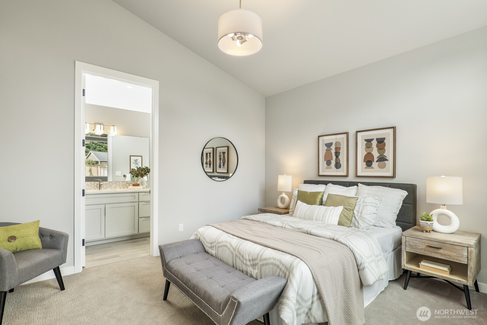 10024 Northeast 196th Place Bothell, WA 98011 - Photo 33 of 40 a bedroom with a bed and a chandelier