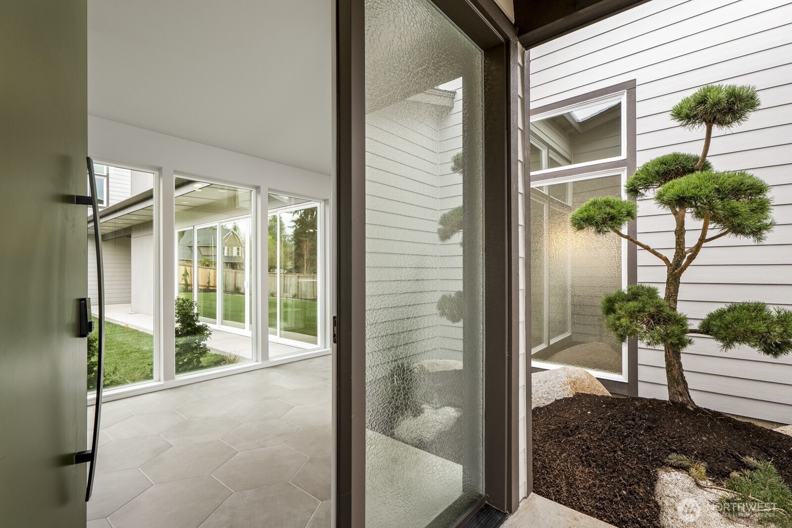 10024 Northeast 196th Place Bothell, WA 98011 - Photo 6 of 40 a view of a glass door with a balcony