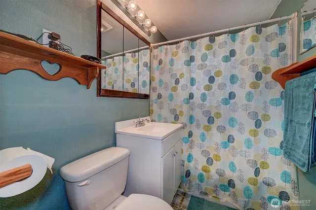a bathroom with a toilet and a sink